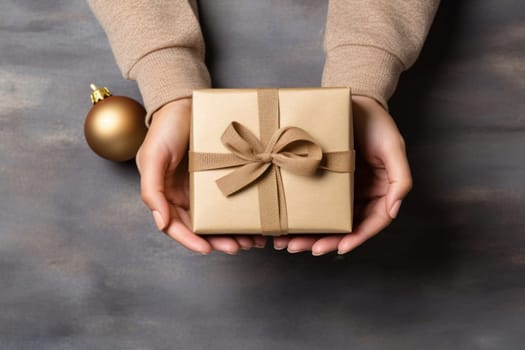 Hands holding gift box, preparing surprise for holiday, top view. Generative AI.