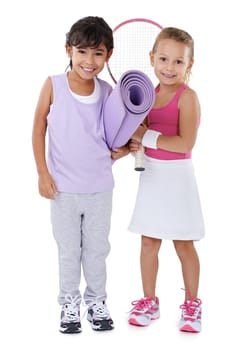 Tennis, sports and portrait of children on a white background for training, workout and exercise. Fitness, friends and isolated young kids with yoga mat, racket and equipment for hobby in studio.