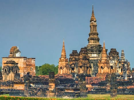 Wat Mahathat temple in Sukhothai historical park by day, UNESCO World Heritage Site, Thailand