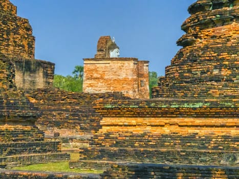 Wat Mahathat temple in Sukhothai historical park by day, UNESCO World Heritage Site, Thailand