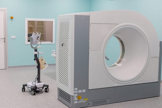 Moscow, Moscow region, Russia - 03.09.2023:A high-tech CT scanner in a clean, empty hospital radiology room.