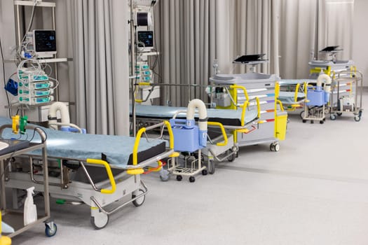 Moscow, Moscow region, Russia - 03.09.2023:Hospital ward showcasing a line of beds with attached monitors and medical apparatus, ready for patient care.