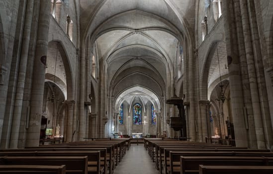France, Paris - Jan 02, 2024 - Interior of Saint-Pierre de Montmartre Church in Paris. View of the nave and gothic rib vault ceiling at the Paroisse Saint Pierre de Montmartre or the Church of Saint Peter of Montmartre, France is one of the oldest surviving churches of Paris. Space for text, Selective focus.