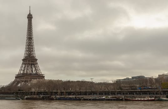 France, Paris - Jan 4, 2024 - Nice scenery of Eiffel Tower and Seine River in Paris at Afternoon. Destinations in Europe. Space for text, Selective focus.