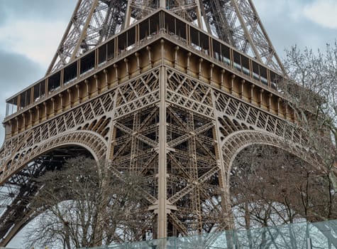France, Paris - Jan 4, 2024 - Architectural detail design of the famous Eiffel Tower iron structure. Close-up of the framework of the Eiffel Tower in Paris, France, Space for text, Selective focus.