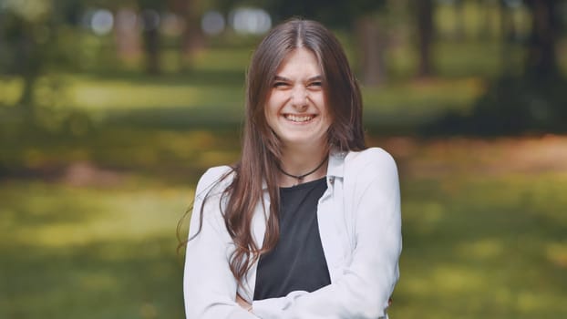 Portrait of a smiling young Georgian girl in a park