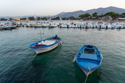 Mondello, Italy - July 17, 2023: Small motorboats anchored at the local marina.