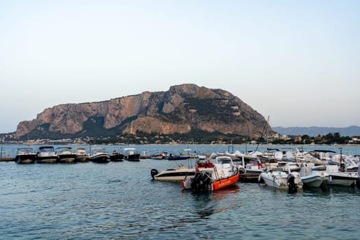 Mondello, Italy - July 17, 2023: Small motorboats anchored at the local marina.