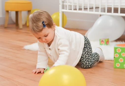 Girl playing with toys in the children's room