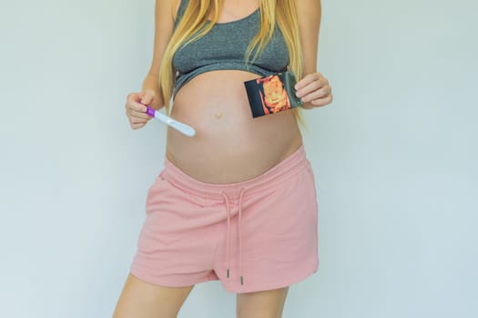 Joyful pregnant woman shares the exciting news, proudly displaying her positive pregnancy test and a heartwarming ultrasound photo.