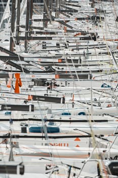 Monaco, Monte-Carlo, 18 October 2022: many sailing boats of the World Championship of J70 class participants stand in a row waiting for the wind for the stage of the sailing race. High quality photo