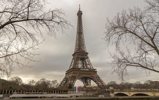 France, Paris - Jan 4, 2024 - Nice scenery of Eiffel Tower and Seine River in Paris at Afternoon. Destinations in Europe. Space for text, Selective focus.