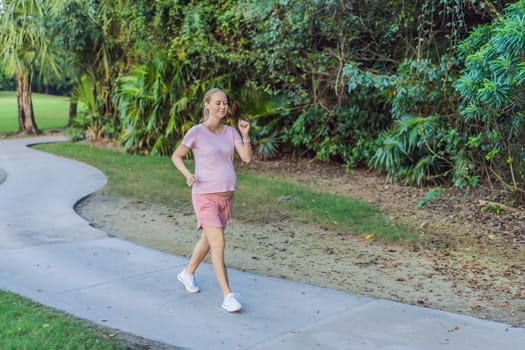 Active and determined, a pregnant woman maintains a healthy lifestyle, jogging with a focus on well-being and fitness during pregnancy.