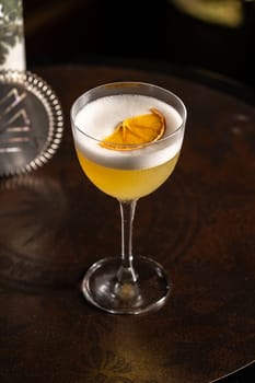 Luxury cocktail on the wooden table on a dark background