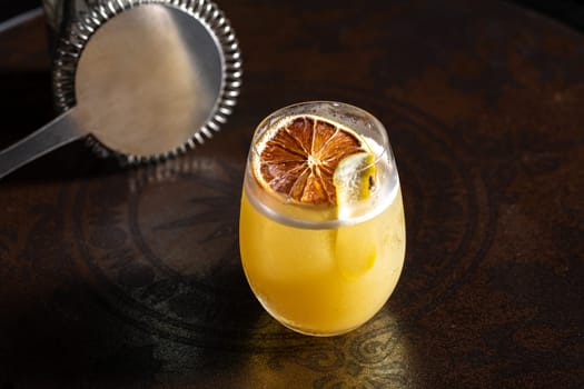 Luxury cocktail on the wooden table on a dark background