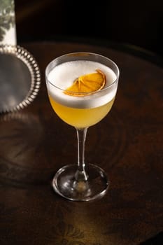 Luxury cocktail on the wooden table on a dark background