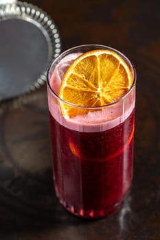 Luxury cocktail on the wooden table on a dark background