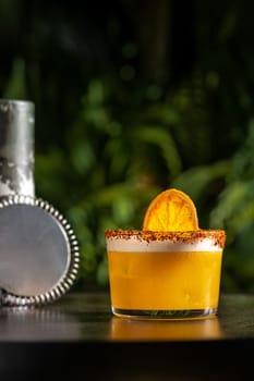 Luxury cocktail on the wooden table on a dark background