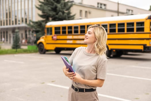 a woman near a school bus.