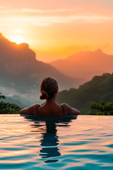 woman in the pool looks at the mountains. Selective focus. travel.