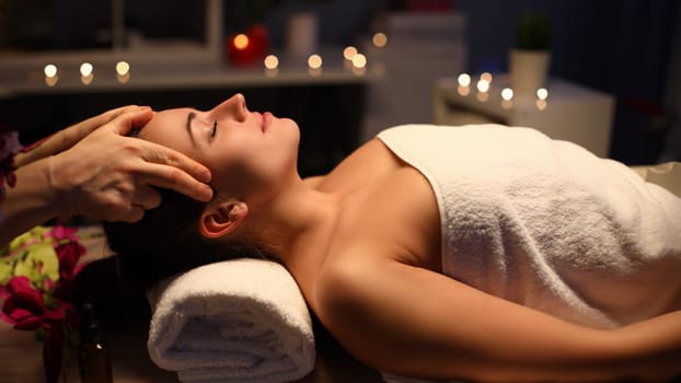 Girl doing relaxation head massage in beauty salon. Unforgettable sensations lightness and vivacity. Deep relaxation technique. Fingers massage head to beautiful girl. Pleasant sensations