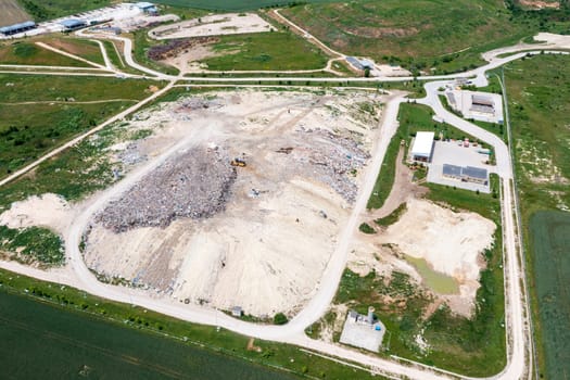 Aerial top view of a city garbage dump. Waste Disposal Facility