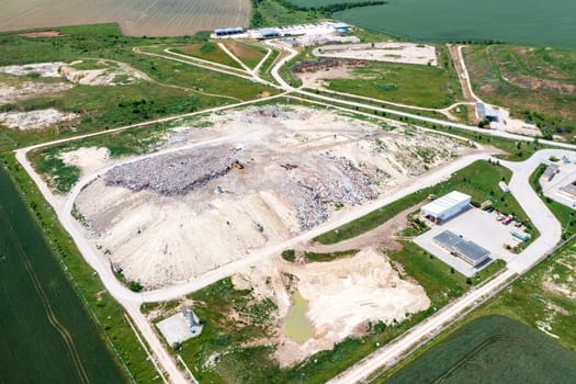 Aerial top view of a city garbage dump. Waste Disposal Facility