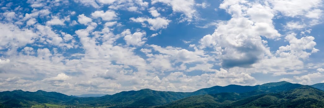 aerial panorama of beautiful clouds over the mountain hills