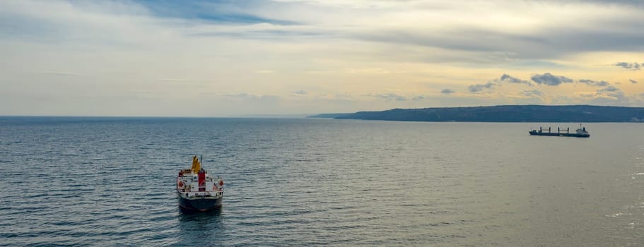 Ships at sea. Aerial top view of cargo ship vessel import export sailing.