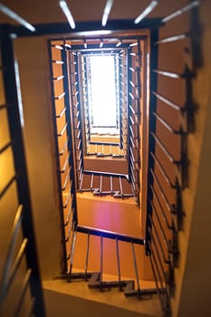 Up view of the staircase in the building. Vertical view