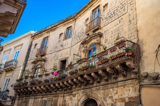 Sicily. One of the spectacular balconies in the city is an example of the Sicilian baroque style.