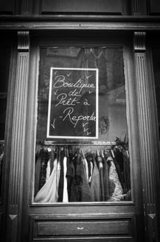 Bordeaux, France, January 14, 2024: Red wooden window of a second-hand clothes shop to be reported. High quality photo