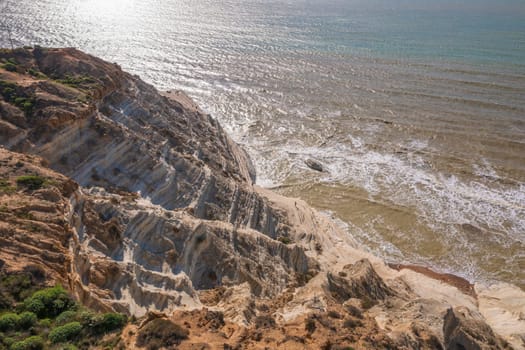 Aerial view of the limestone white cliffs, Stair of the Turks or Turkish Steps near Realmonte in Agrigento province. Sicily, Italy