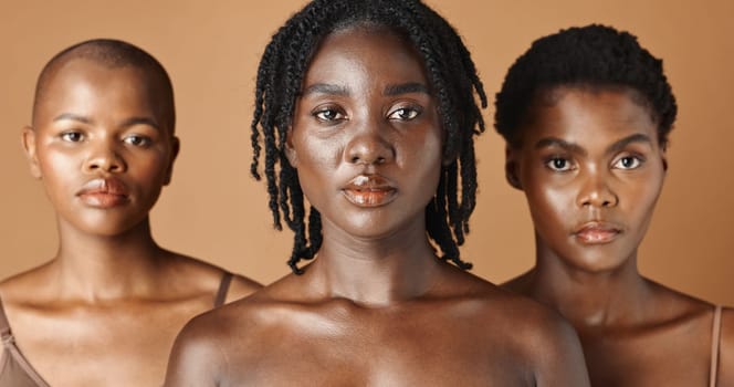 African, face or natural models with skincare, glowing skin or afro isolated on brown background. Facial dermatology, black women or beauty cosmetics for makeup in studio with girl friends or people.