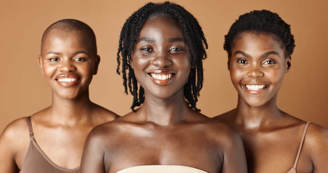 Face, beauty and natural with black woman friends in studio on a brown background for a wellness routine. Portrait, skincare and smile with a group of people looking confident at antiaging treatment.
