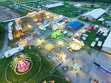 Aerial View of a Bustling Fairground at Dusk, Illuminated with Colorful Neon Lights at Allen County Fair Grounds, Indiana, 2015