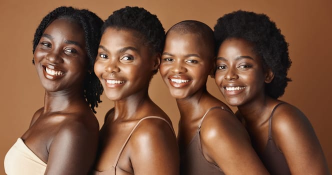 Face, beauty and smile with black woman friends in studio on a brown background for natural wellness. Portrait, skincare and happy with a group of people looking confident at antiaging treatment.