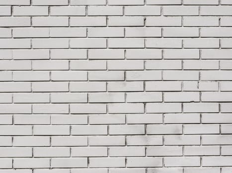 Grunge white brick backdrop.