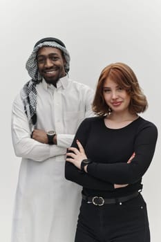 Muslim entrepreneur and a contemporary red-haired girl strike a pose together against a clean white background, embodying confidence, diversity, and a dynamic entrepreneurial spirit in their partnership.