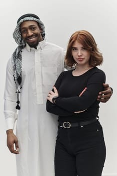 Muslim entrepreneur and a contemporary red-haired girl strike a pose together against a clean white background, embodying confidence, diversity, and a dynamic entrepreneurial spirit in their partnership.