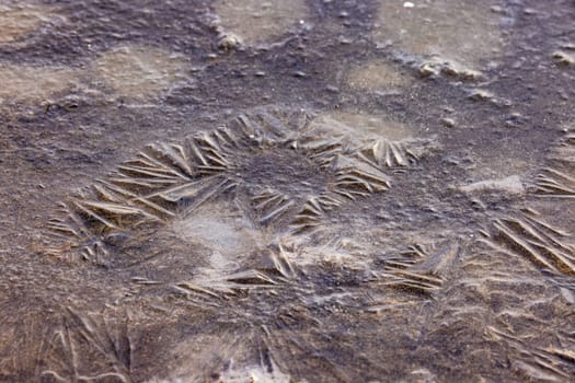 Smooth ice on an agricultural field in the cold in winter after an ice shower