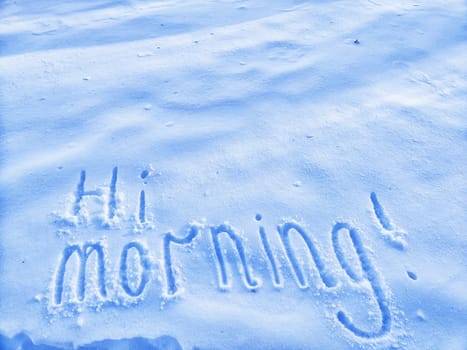 Inscription Hi, written on white background of the snow. Top view. Flat lay. New year and Christmas. Greeting morning, day, weather, sun and people