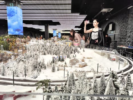 Saint-Petersburg, Russia - August 03, 2023: grand project Russia. Layout of city, country, street, landscape with small toy people, houses, roads, cars, nature and visitors tourists in the museum