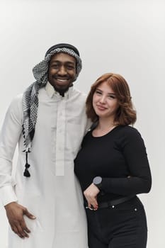 Muslim entrepreneur and a contemporary red-haired girl strike a pose together against a clean white background, embodying confidence, diversity, and a dynamic entrepreneurial spirit in their partnership.