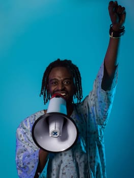 In a powerful and symbolic image, an African American man wears traditional clothing, passionately wields a megaphone against a striking blue background, with his hand raised in the air symbolizing his vocal and cultural empowerment in the pursuit of social justice and equality.