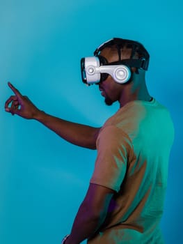 Immersed in a digital realm, an African American man navigates the virtual landscape with a VR goggles, using tactile gestures to interact with virtual objects, showcasing a harmonious blend of technology, innovation, and diverse empowerment.