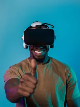 African American man wearing virtual reality glasses expresses satisfaction and impressed delight, gesturing with his hand pointed upward, while standing isolated against a vibrant yellow background, showcasing a positive and contented experience within the immersive virtual realm.