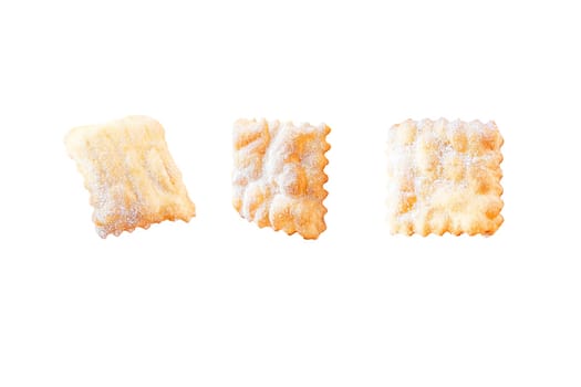 Traditional sweet crisp pastry deep-fried and sprinkled with powdered sugar isolated on white background. Carnival food tradition. Italy