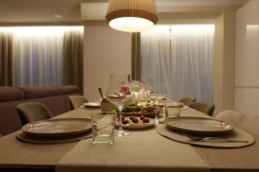 Table served for festive dinner in living room