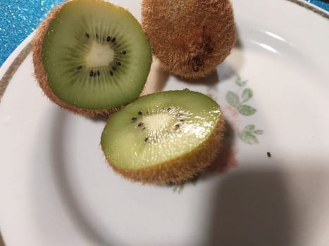 Fresh green kiwi fruit on a the plate